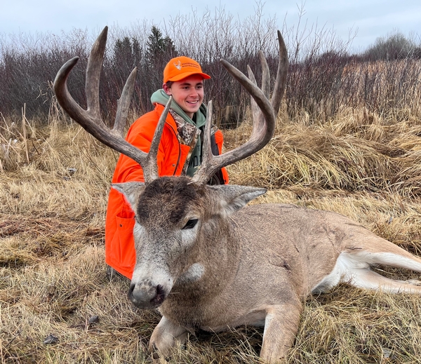 Young Wisconsin Hunter Tags out on a Manitoba Monster Whitetail