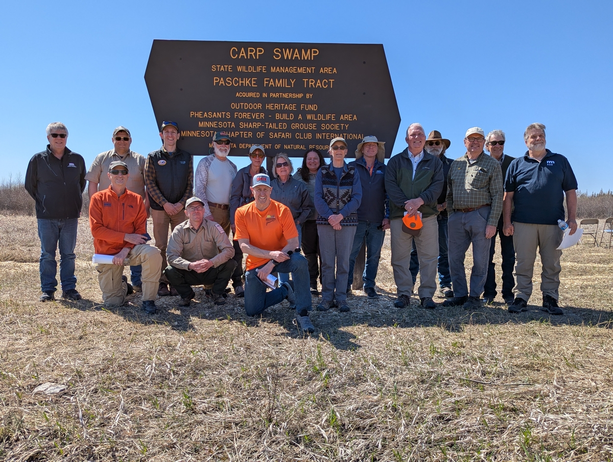 Supporters gather for a group photo following a dedication ceremony for the Paschke Family Tract addition to the Carp Swamp Wildlife Management Area Saturday, May 3, 2025, near Baudette, Minnesota.