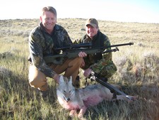 A couple happy coyote hunters