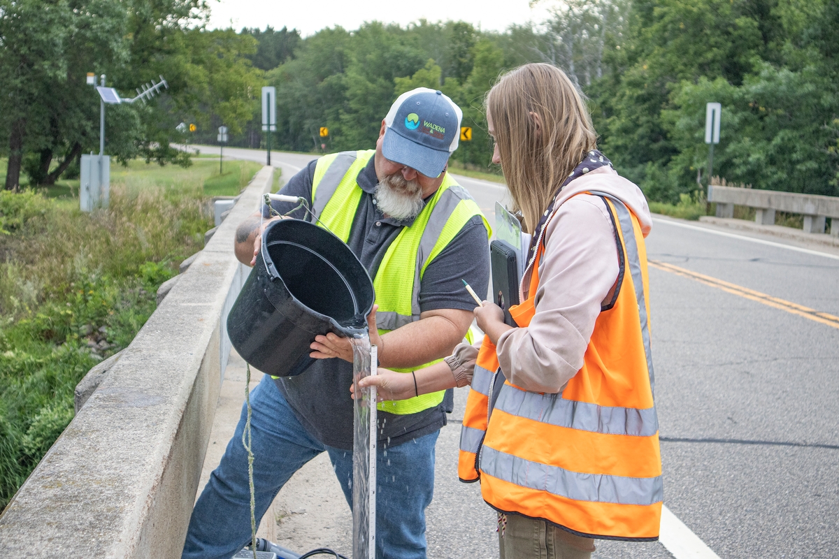 Photo Don and Alyson taking water samples.